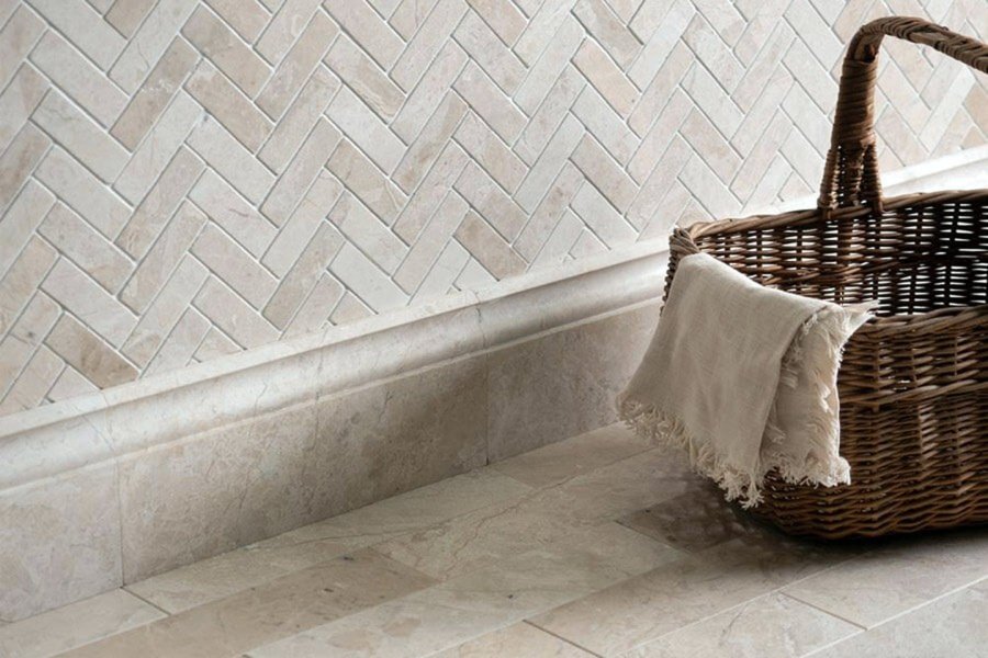 Marble skirting installed along a wall and floor